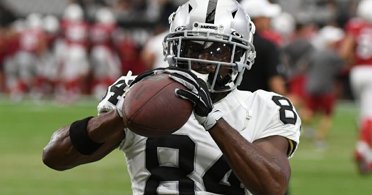 Antonio Brown of the Oakland Raiders warms up prior to an NFL preseason game against the Arizona Cardinals at State Farm Stadium on Aug. 15, 2019.