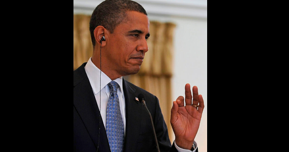 President Barack Obama reacts to being able to hear the translation after missing most of then-Portuguese Prime Minister Jose Socrates' (unseen) remarks due to technical difficulty during a joint statement on Nov. 19, 2010, in Lisbon.