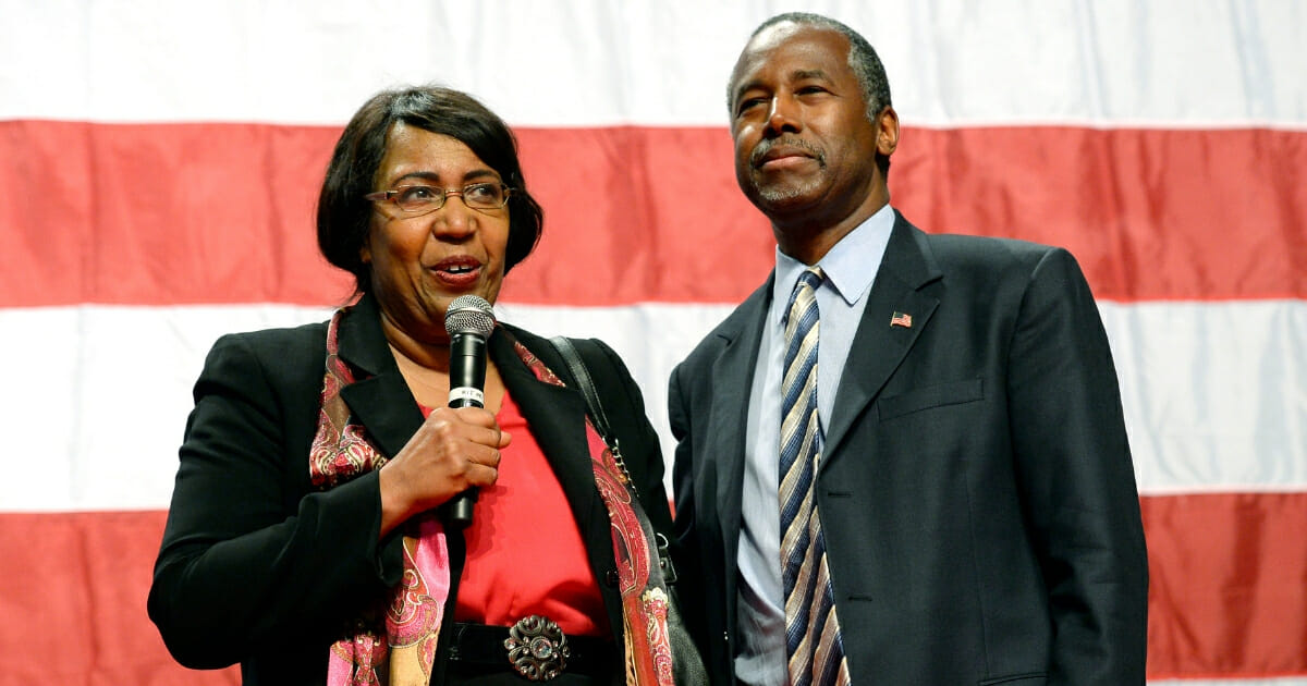 Candy Carson and then-Republican presidential candidate Ben Carson speak during a campaign rally at the Anaheim Convention Center in California on Sept. 9, 2015.