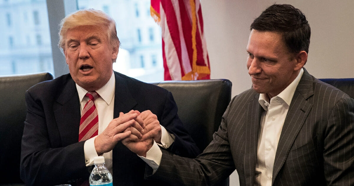 Then-President-elect Donald Trump shakes the hand of Peter Thiel during a meeting with technology executives at Trump Tower on Dec. 14, 2016 in New York City.