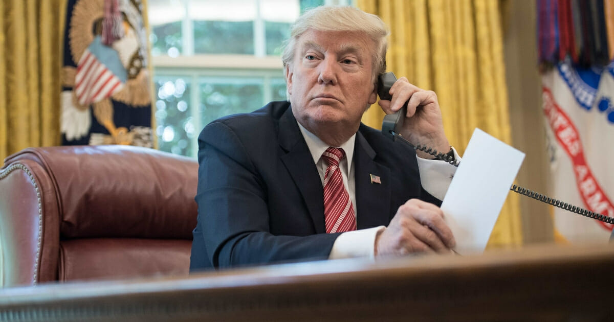 President Donald Trump waits to speak on the phone with Irish Prime Minister Leo Varadkar to congratulate him on his recent election victory in the Oval Office at the White House in Washington, D.C., on June 27, 2017.