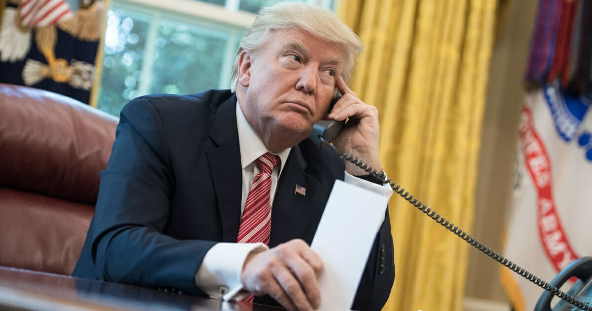 President Donald Trump waits to speak on the phone with Irish Prime Minister Leo Varadkar to congratulate him on his recent election victory in the Oval Office at the White House in Washington, D.C., on June 27, 2017.