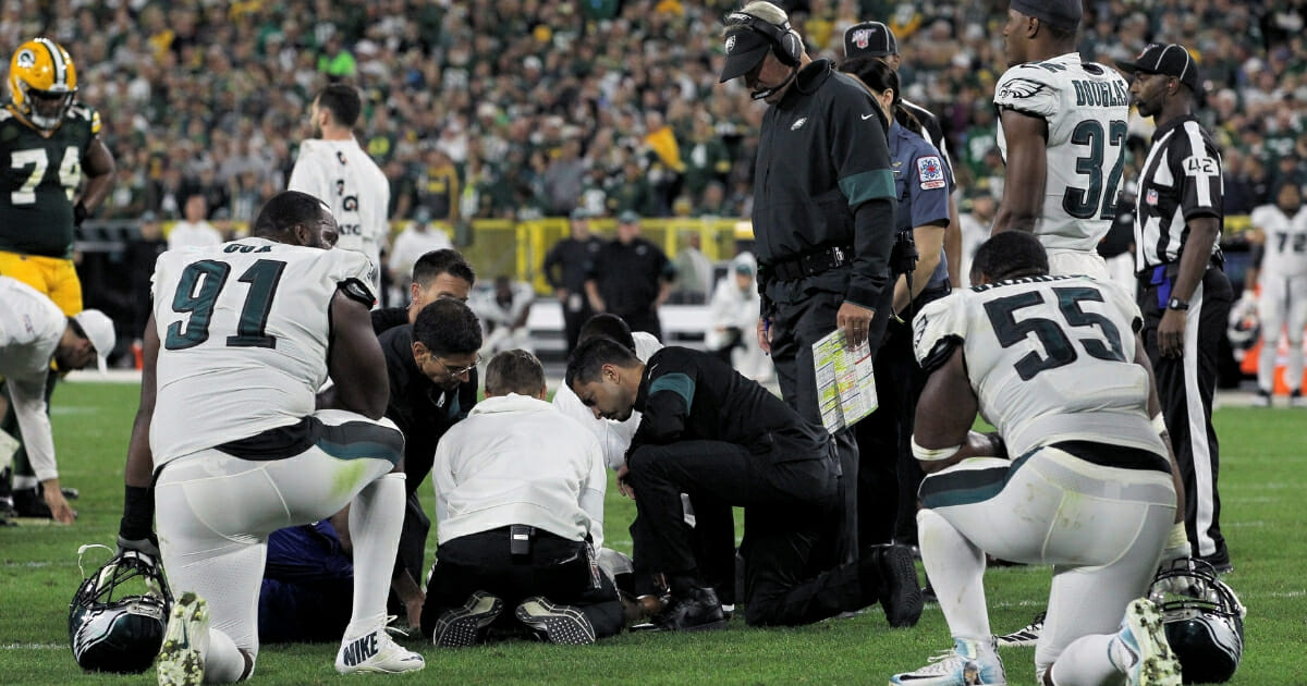 Avonte Maddox of the Philadelphia Eagles is attended to after being injured in the fourth quarter against the Green Bay Packers at Lambeau Field on Sept. 26, 2019.