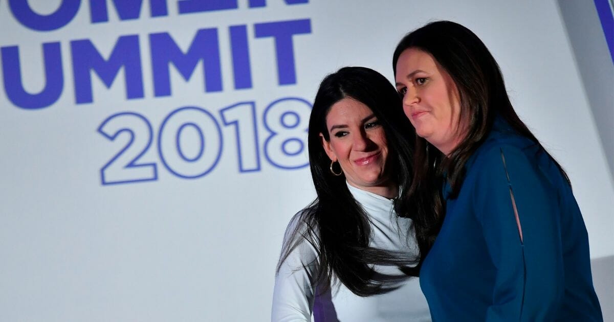 Then-White House press secretary Sarah Sanders, right, stands next to Eliana Johnson, a Politico reporter, during the 6th annual Women Rule Summit at a hotel in Washington, D.C. on Dec. 11, 2018.