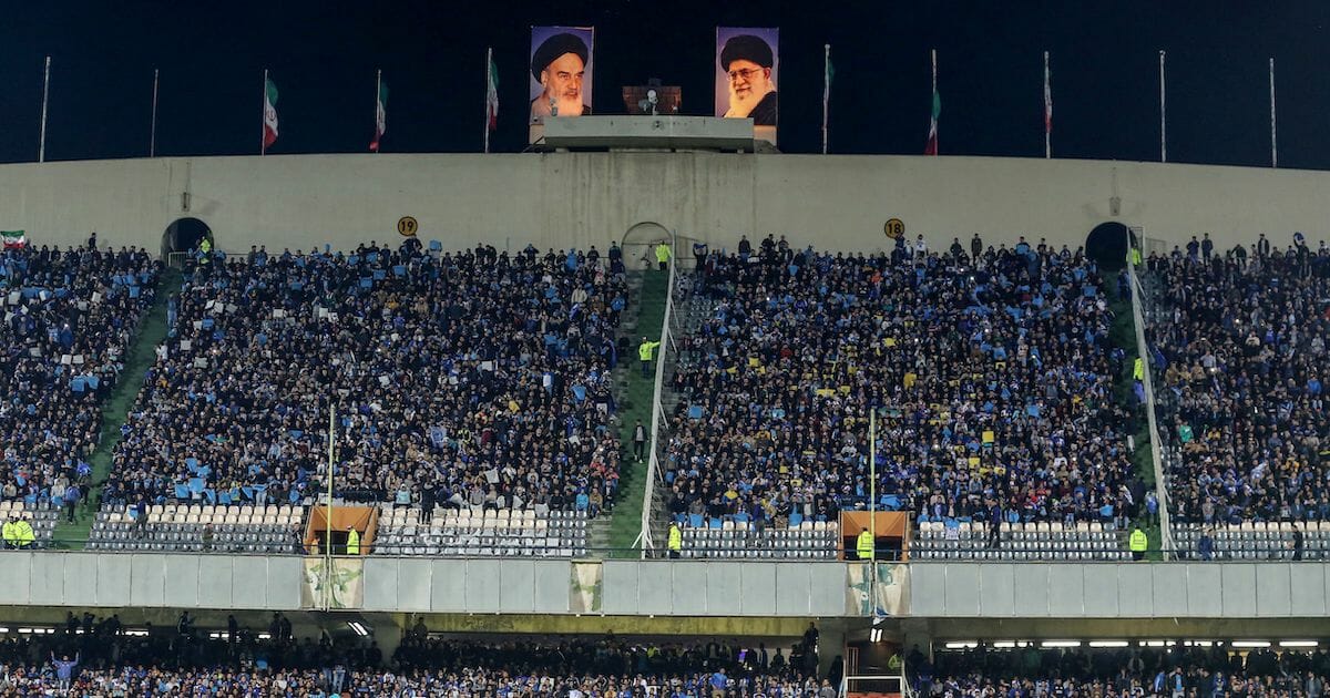 Esteghlal's fans cheer for their team during the AFC champions league Group C football match between Iran's Esteghlal and UAE's Al Ain at the Azadi stadium in the Iranian capital Tehran on March 12, 2019.