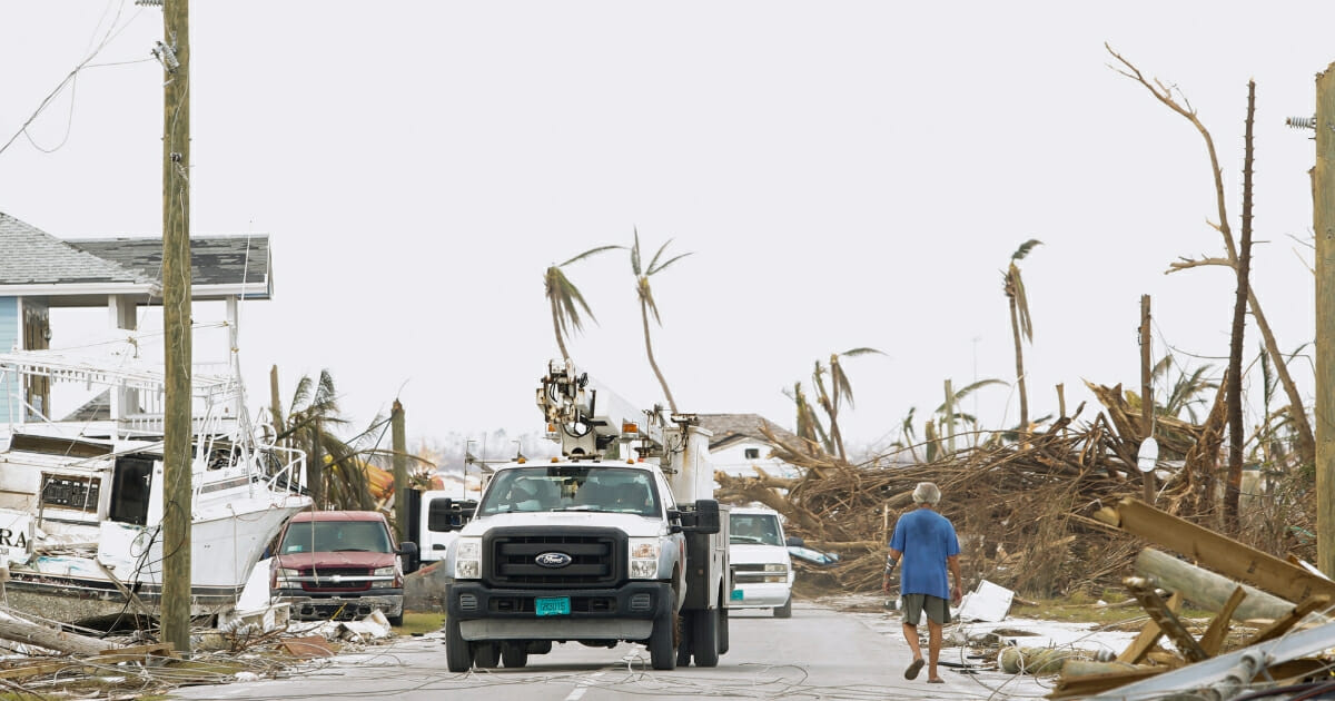 A power authority truck parks near downed wires on devastated Great Abaco Island on Sept. 6, 2019, in the Bahamas.