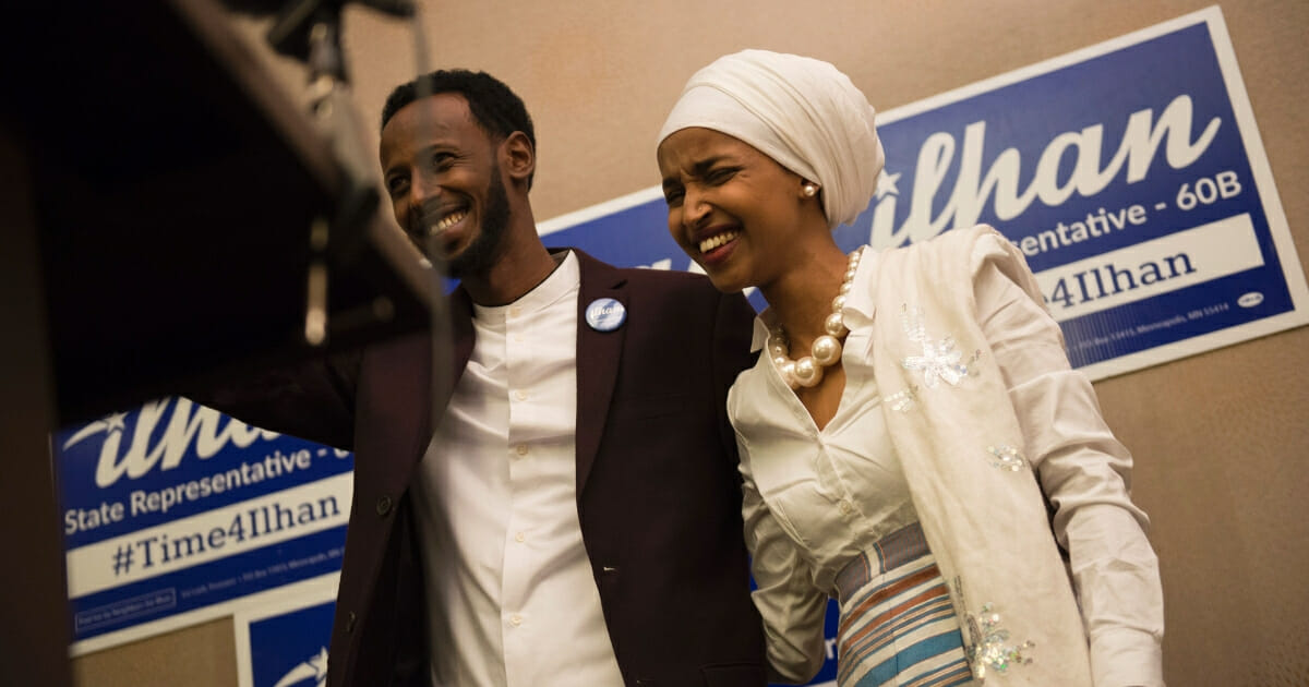lhan Omar, then a candidate for state representative for District 60B in Minnesota, with her husband Ahmed Hirisi, arrives for her victory party on election night on Nov. 8, 2016, in Minneapolis, Minnesota.