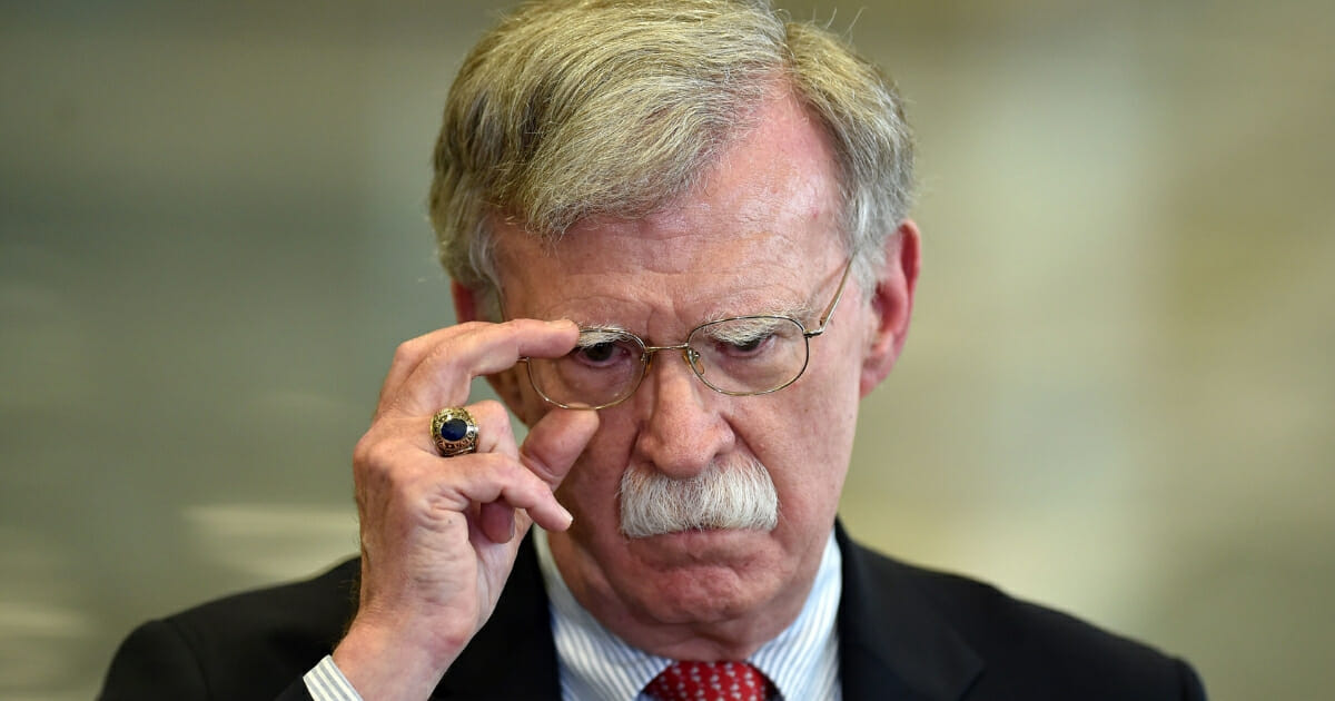 Then-national security adviser John Bolton answers journalists' questions after his meeting in Minsk on Aug. 29, 2019.