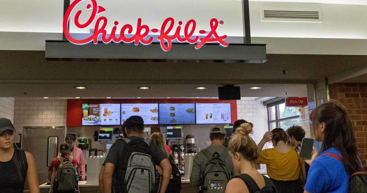 Students wait in line at the Chick-fil-A in the University of Kansas student union.