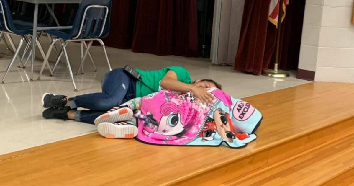 A custodian comforted a 4th-grader with autism who was having a difficult day.