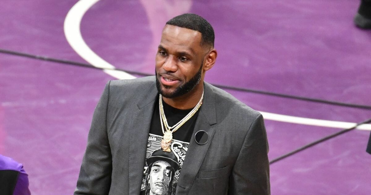 LeBron James wears a shirt as a tribute to Nipsey Hussle during a basketball game between the Los Angeles Lakers and the Golden State Warriors at the Staples Center on April 4, 2019, in Los Angeles, California.