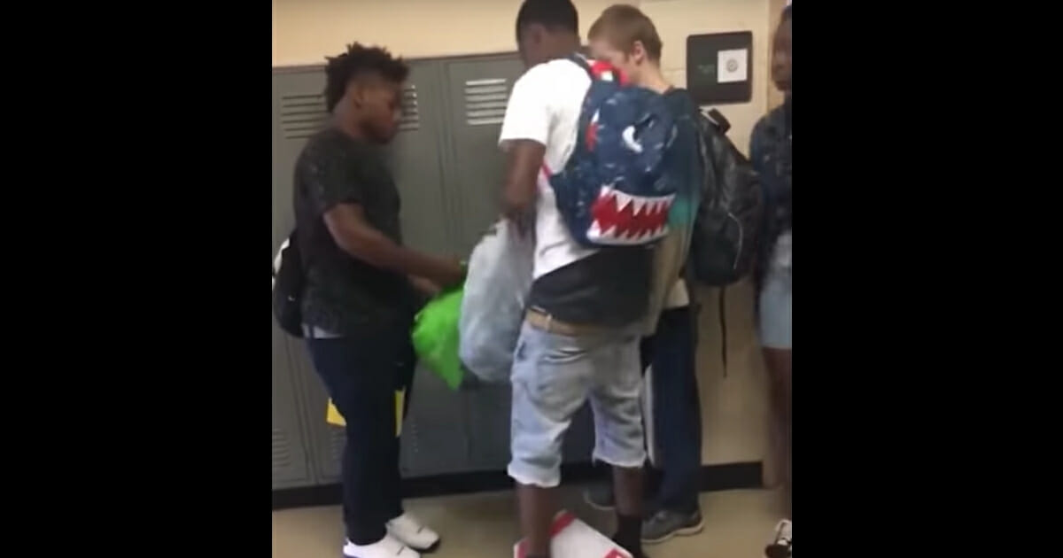 Two Football Players Buy New Clothes for Boy Who Was Bullied for Wearing the Same Outfit Every Day