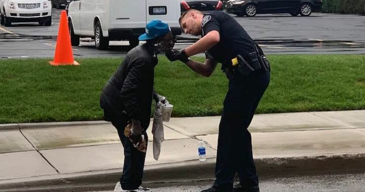 Police officer helps homeless man shave