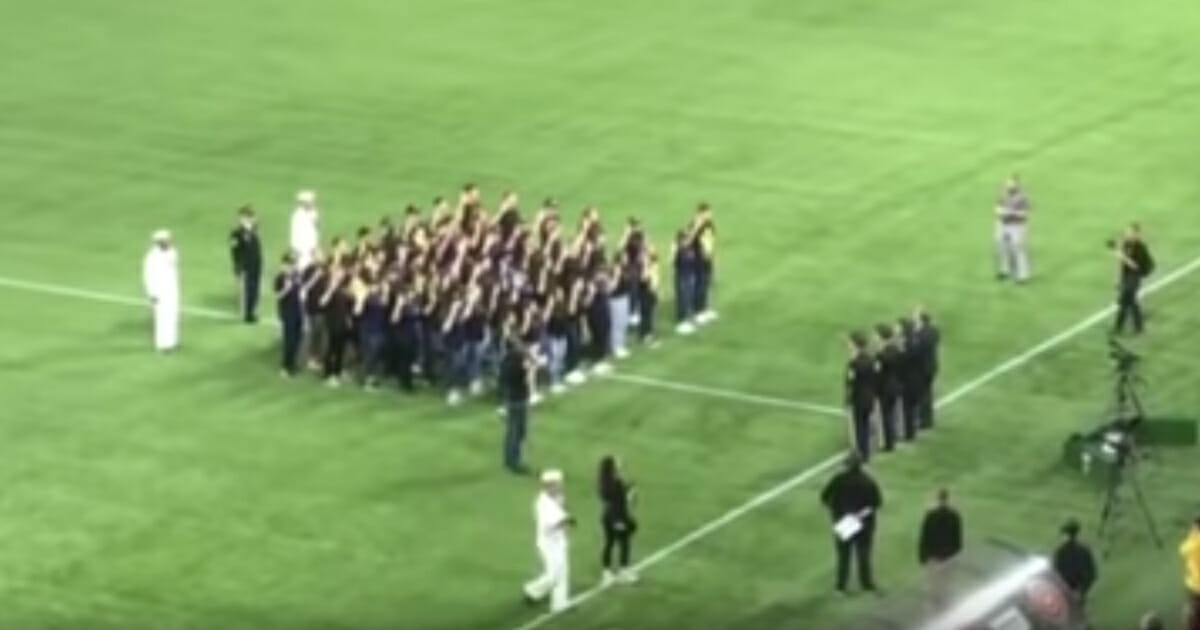 A military swearing-in ceremony at a women's professional soccer game took an unexpected turn Wednesday when the enlistees were asked to "obey the orders of the president of the United States."