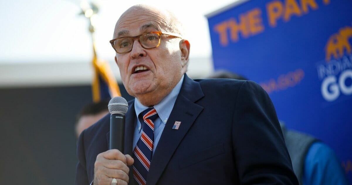 Former New York City Mayor Rudy Giuliani arrives to campaign for Republican Senate hopeful Mike Braun on Nov. 3, 2018, in Franklin Township, Indiana.