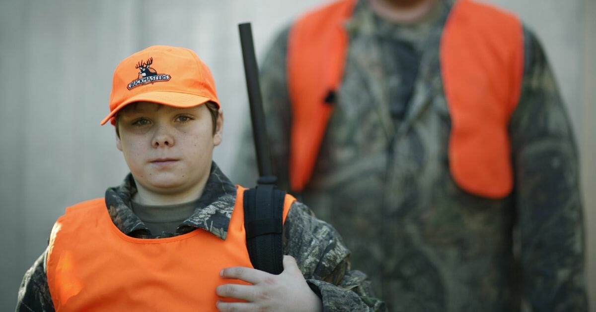 A father and son pair on the younger's first day of hunting in November 2006.