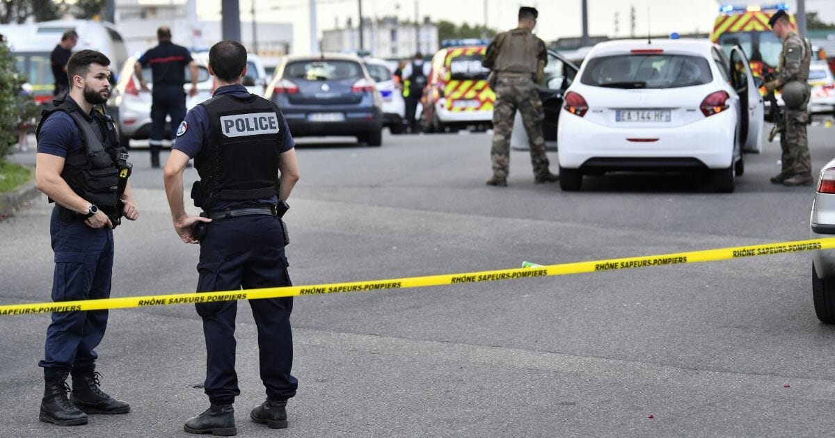French soldiers and police on the scene of a knife attack Saturday in eastern France near Lyon.