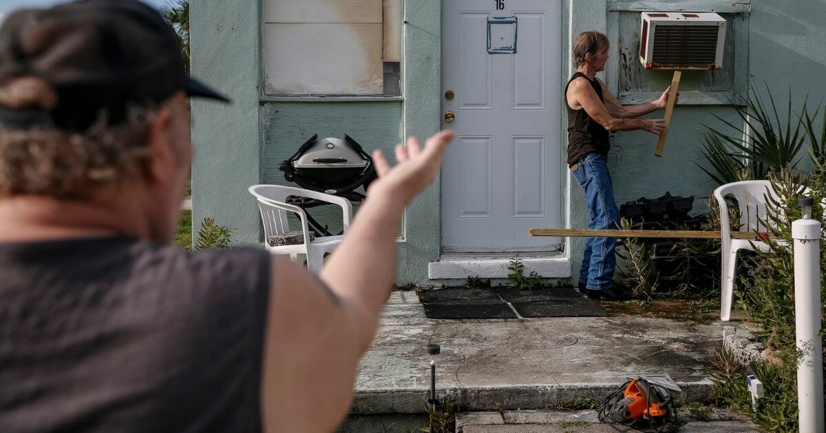Mobile home residents in Jensen Beach, Florida, work to secure their property before leaving under a mandatory evacuation order ahead of Hurricane Dorian. The Category 5 storm, which pummeled the Bahamas, is threatening Florida and other Southeast states.