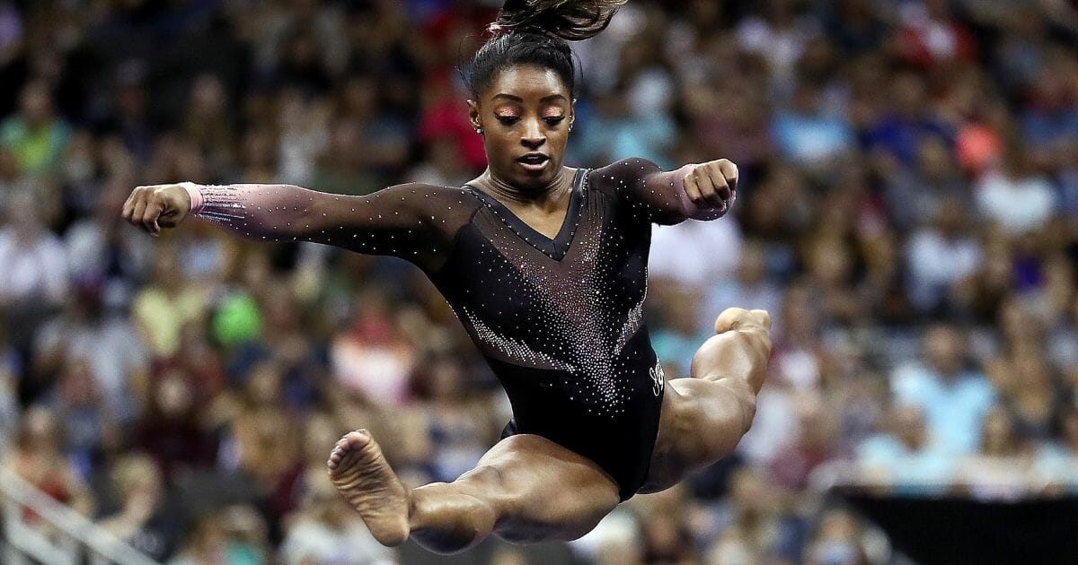 Simone Biles competes on floor exercise during Women's Senior competition of the 2019 U.S. Gymnastics Championships at the Sprint Center on August 11, 2019 in Kansas City, Missouri.