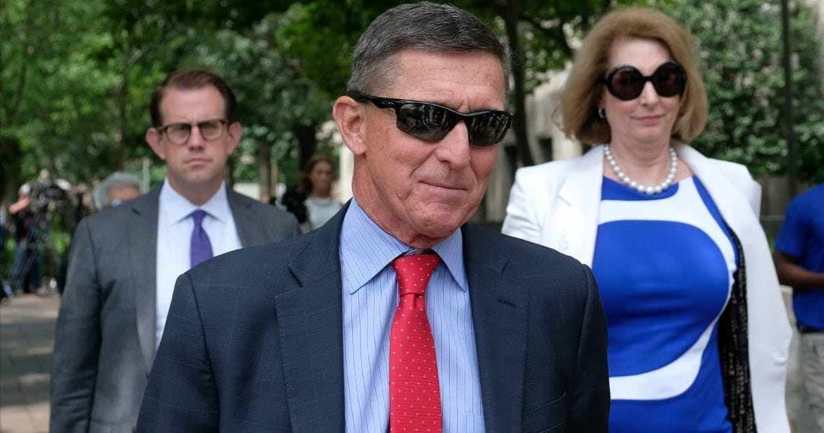 Retired Army Gen. Michael Flynn, who served briefly as President Donald Trump’s national security adviser, leaves a federal courthouse.