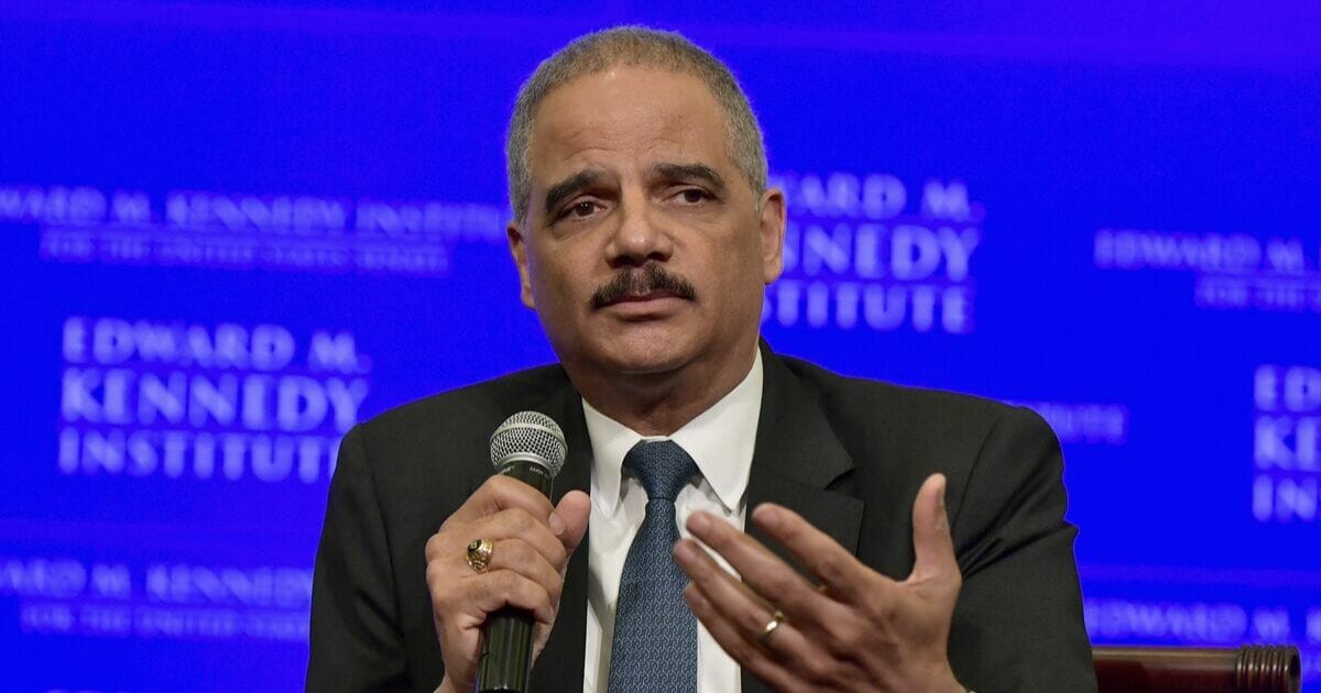 Former Attorney General Eric Holder is interviewed by political commentator Jeffrey Toobin for a discussion on gerrymandering and its impact on the American political system at the Edward M. Kennedy Institute for the United States Senate on May 30, 2018, in Boston, Massachusetts.