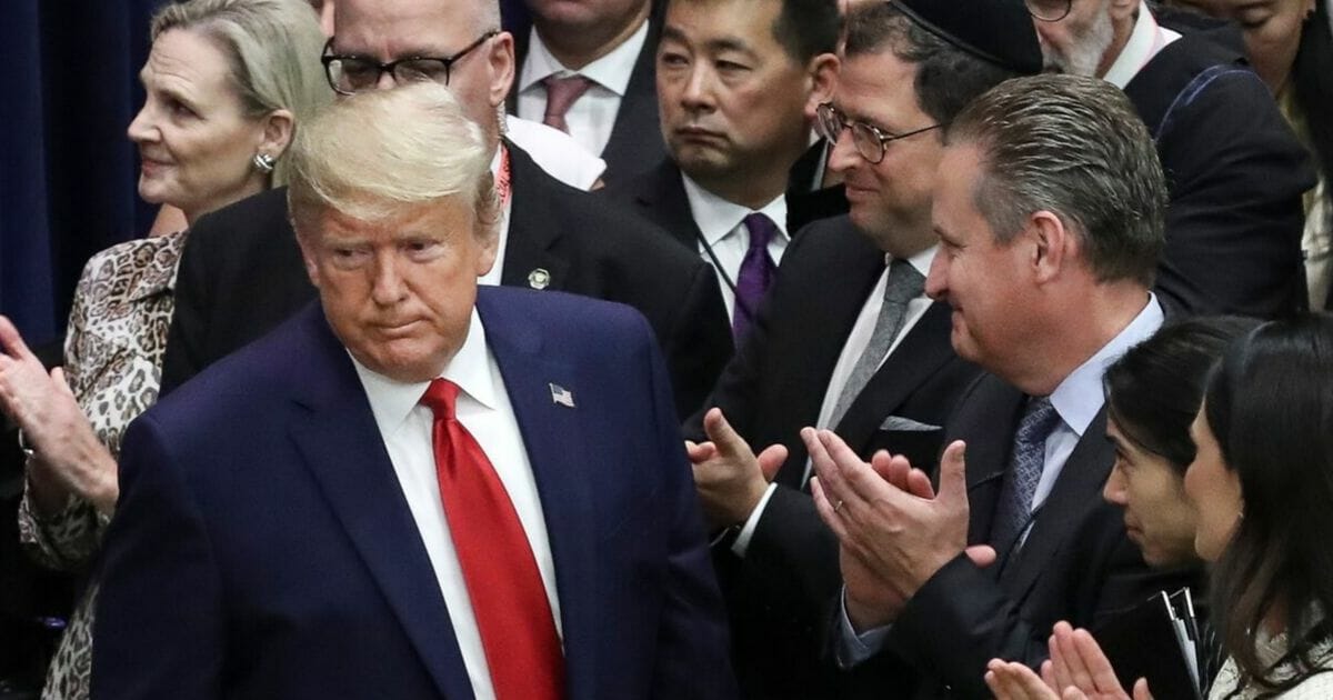 President Donald Trump is applauded on his arrival at a meeting on religious freedom at the United Nations on Sept. 23, 2019.