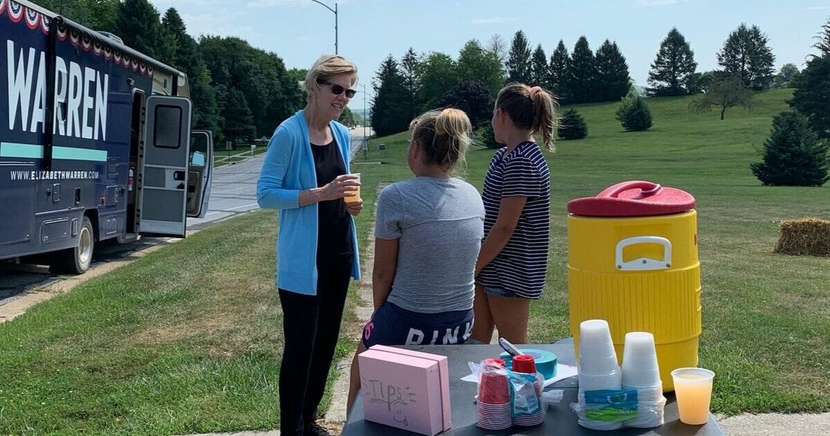 Democratic presidential candidate Massachusetts Sen. Elizabeth Warren stops by a lemonade stand on Aug. 8, 2019, in Harlan, Iowa.