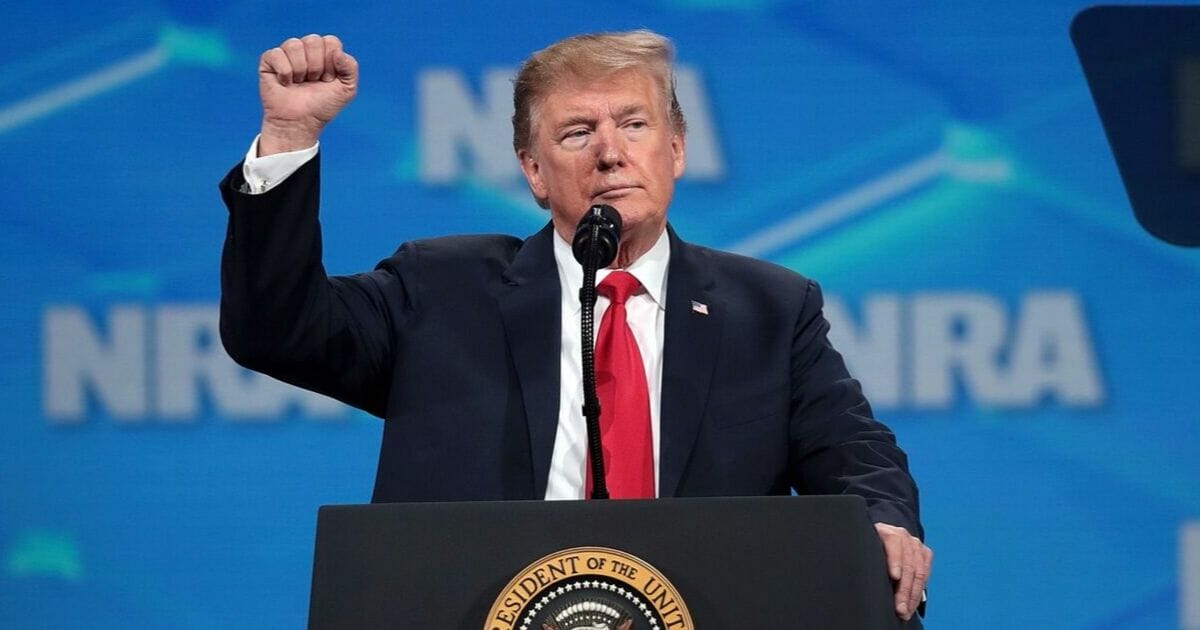 President Donald Trump gestures to the audience at the NRA-ILA Leadership Forum at the 148th NRA Annual Meetings & Exhibits on April 26 in Indianapolis.