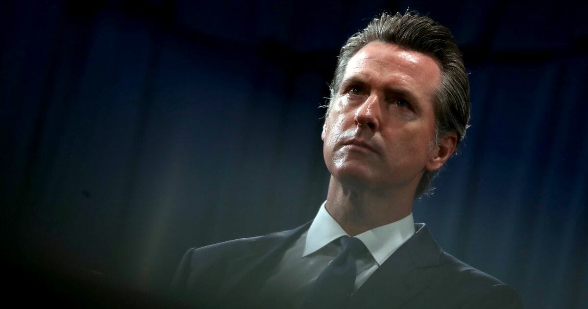 California Gov. Gavin Newsom looks on during a news conference with California attorney General Xavier Becerra at the California State Capitol on August 16, 2019 in Sacramento, California.