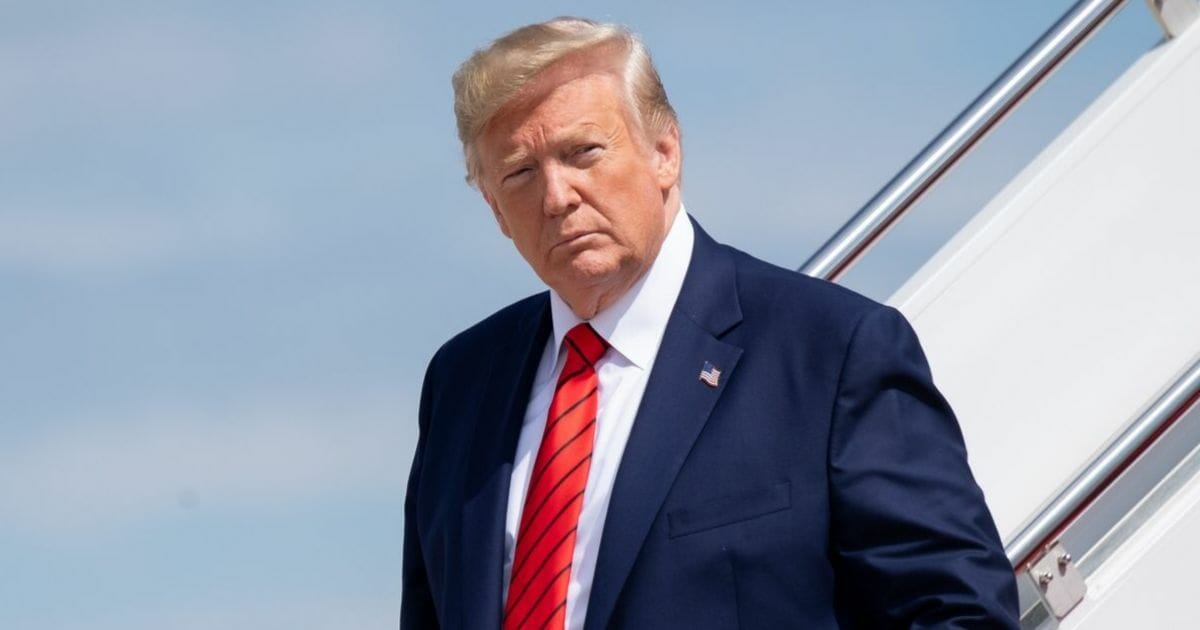 President Donald Trump disembarks after arriving on Air Force One at Joint Base Andrews in Maryland, Sept. 26, 2019.
