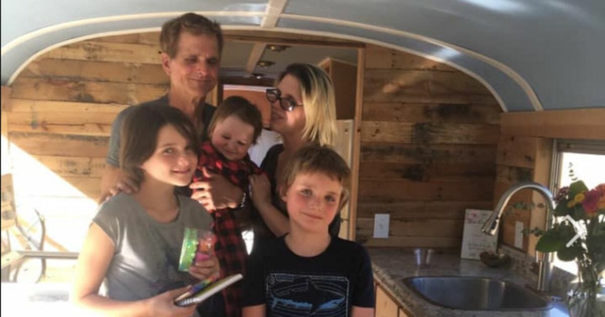 Working homeless family on school bus turned into tiny home.