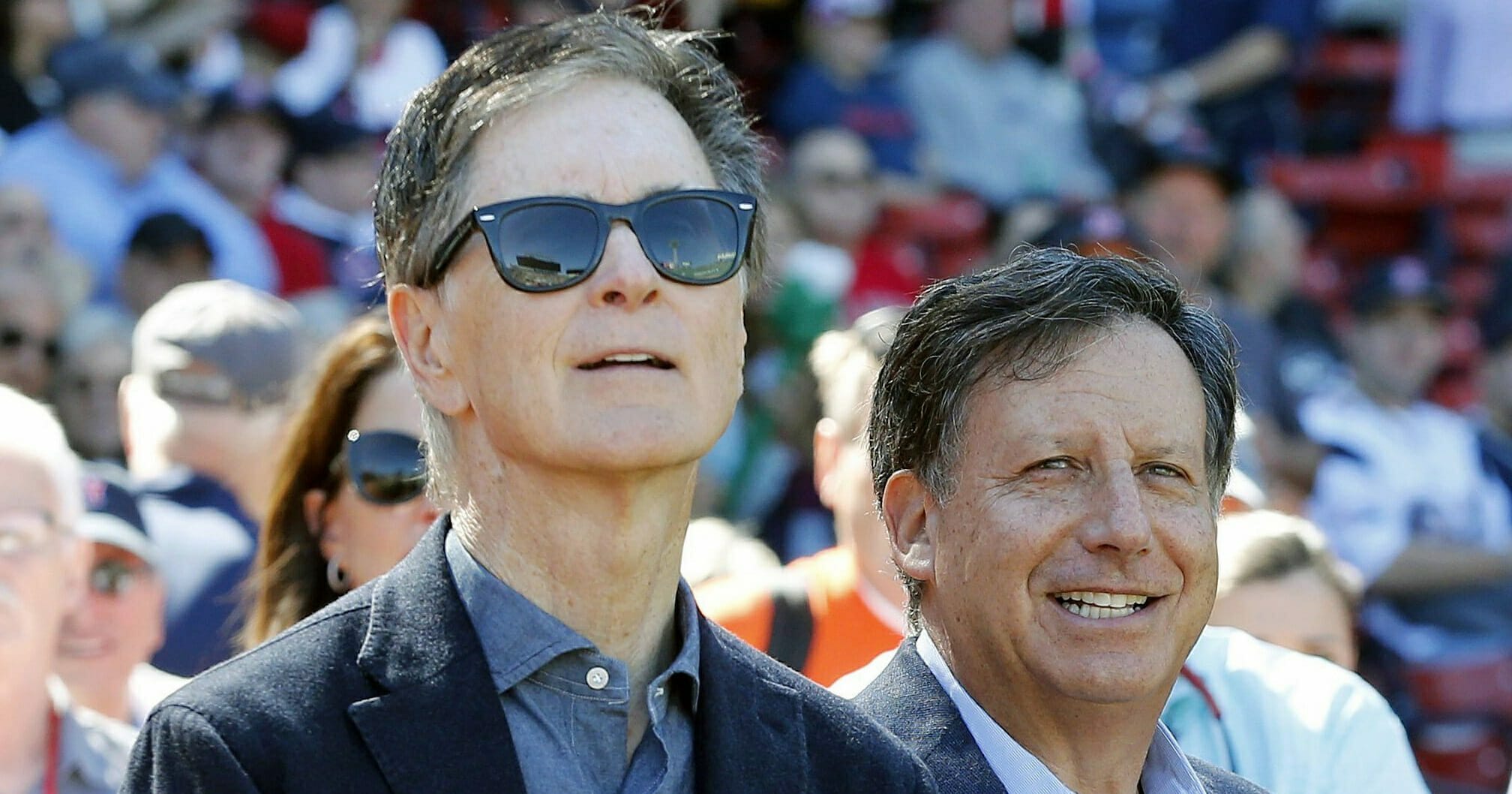 In this Sept. 27, 2015, file photo, Boston Red Sox owners John Henry, left, and Tom Werner look on before a baseball game between the Red Sox and the Baltimore Orioles in Boston.