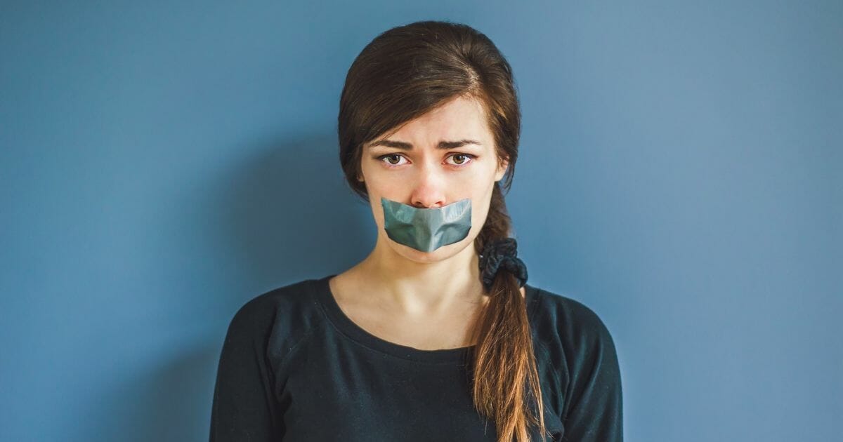 Woman with duct tape over her mouth