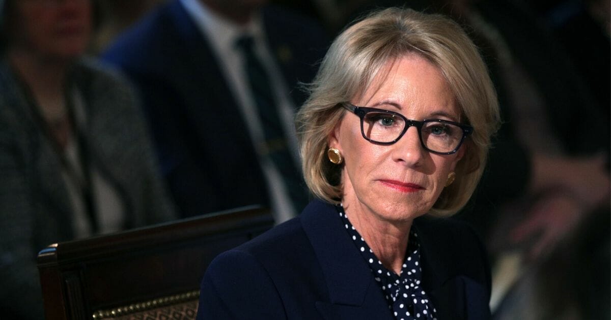 U.S. Secretary of Education Betsy DeVos listens during an Interagency Working Group on Youth Programs meeting at the State Dining Room of the White House March 18, 2019, in Washington, D.C.