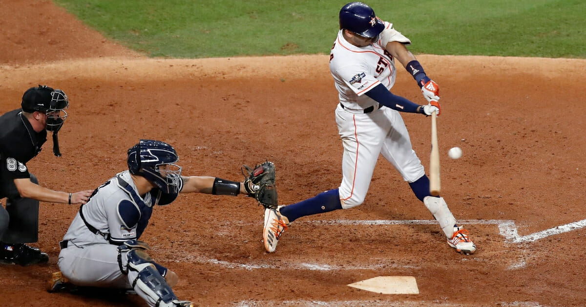 Carlos Correa #1 of the Houston Astros bats in the fourth inning during Game 2 of the American League Championship Series against the New York Yankees at Minute Maid Park on Oct. 13, 2019, in Houston, Texas.