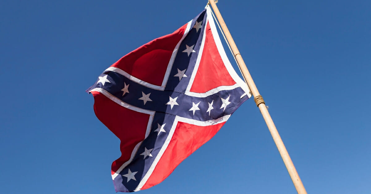 A Georgia high school teacher is in administrative hot water after allegedly sharing a controversial message about the Confederate flag. The image above is a stock photo of a Confederate flag.