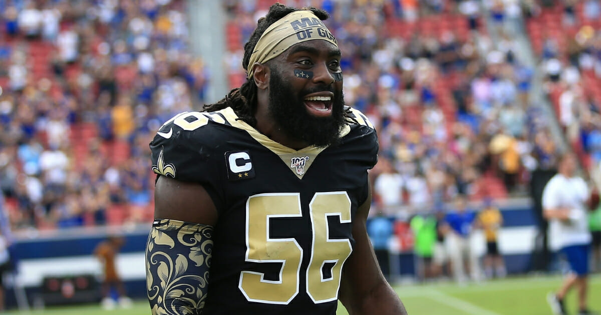 New Orleans Saints linebacker Demario Davis wears his "Man of God" headband before a game against the Los Angeles Rams.