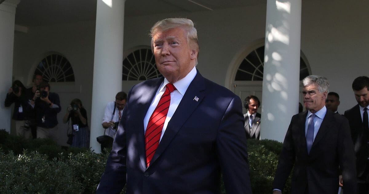 President Donald Trump walks into the Rose Garden to greet and honor the 2019 Stanley Cup Champions, St. Louis Blues at the White House on Oct. 15, 2019, in Washington, D.C.
