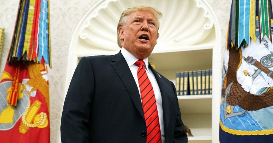 President Donald Trump pauses to answer a reporter's question as he leaves the Oval Office on Sept. 30, 2019, in Washington, D.C.