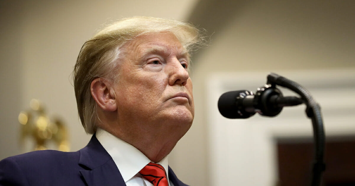 President Donald Trump listens to a question from a reporter at an event for the signing of two executive orders aimed at greater governmental transparency at the White House on Oct. 9, 2019, in Washington, D.C.