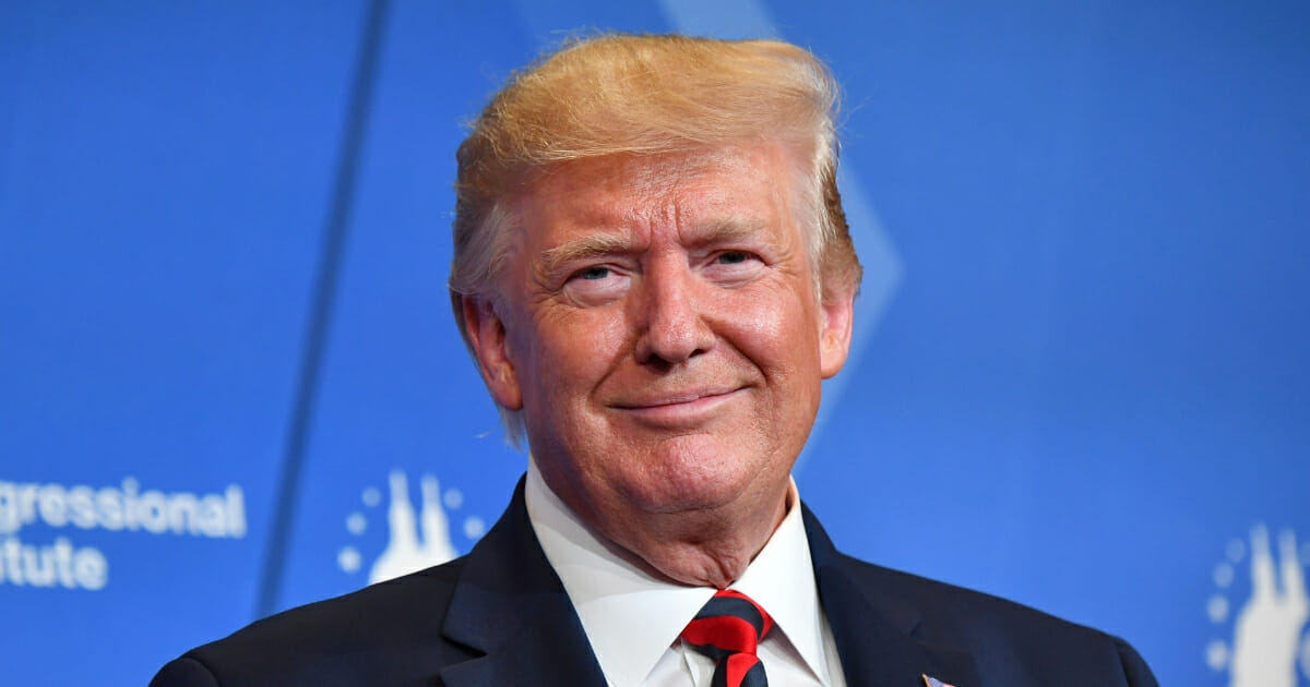 President Donald Trump smiles as he delivers remarks in Baltimore, Maryland, on Sept. 12, 2019.