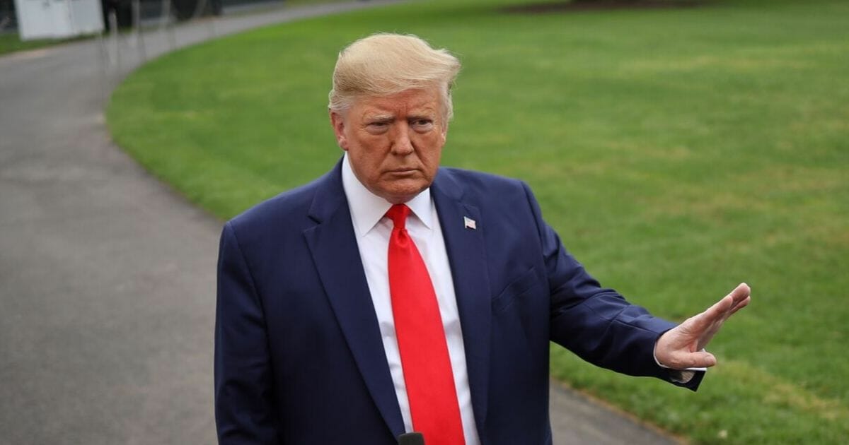 President Donald Trump answers questions while departing the White House on Oct. 3, 2019, in Washington, D.C.