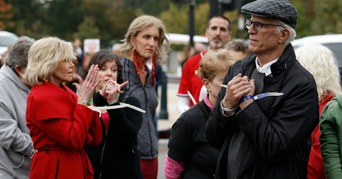 Jane Fonda and Ted Danson are arrested during the "Fire Drill Friday" climate change protest on Oct. 25, 2019, in Washington, D.C .