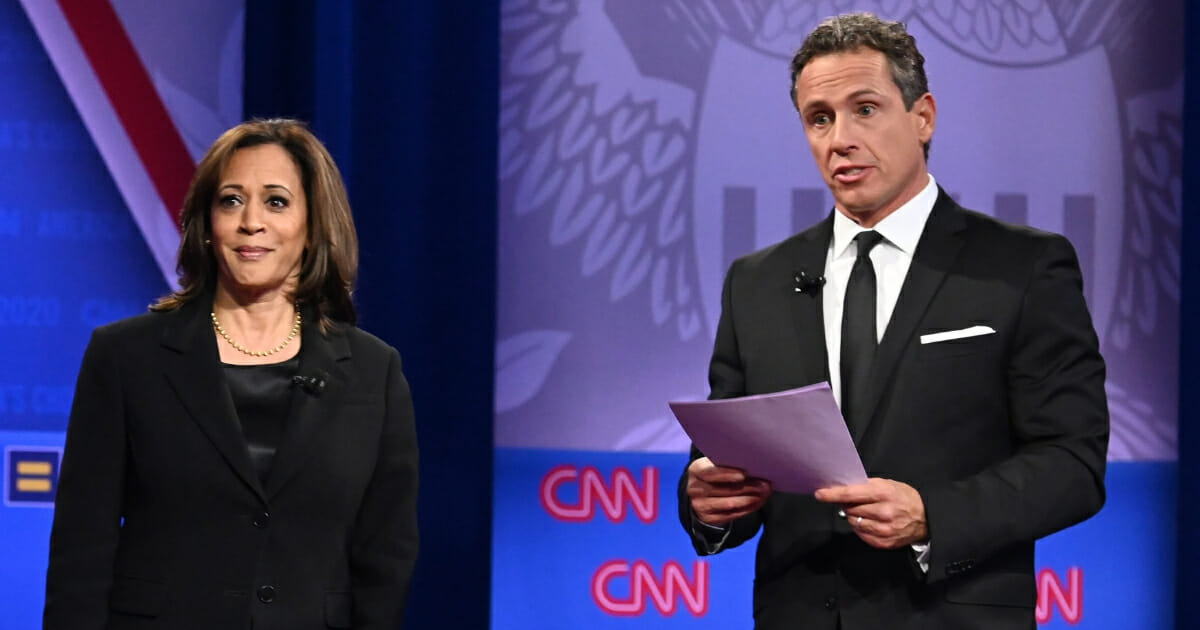 Democratic presidential hopeful and California Sen. Kamala Harris speaks on stage alongside CNN moderator Chris Cuomo during a town hall devoted to LGBT issues.