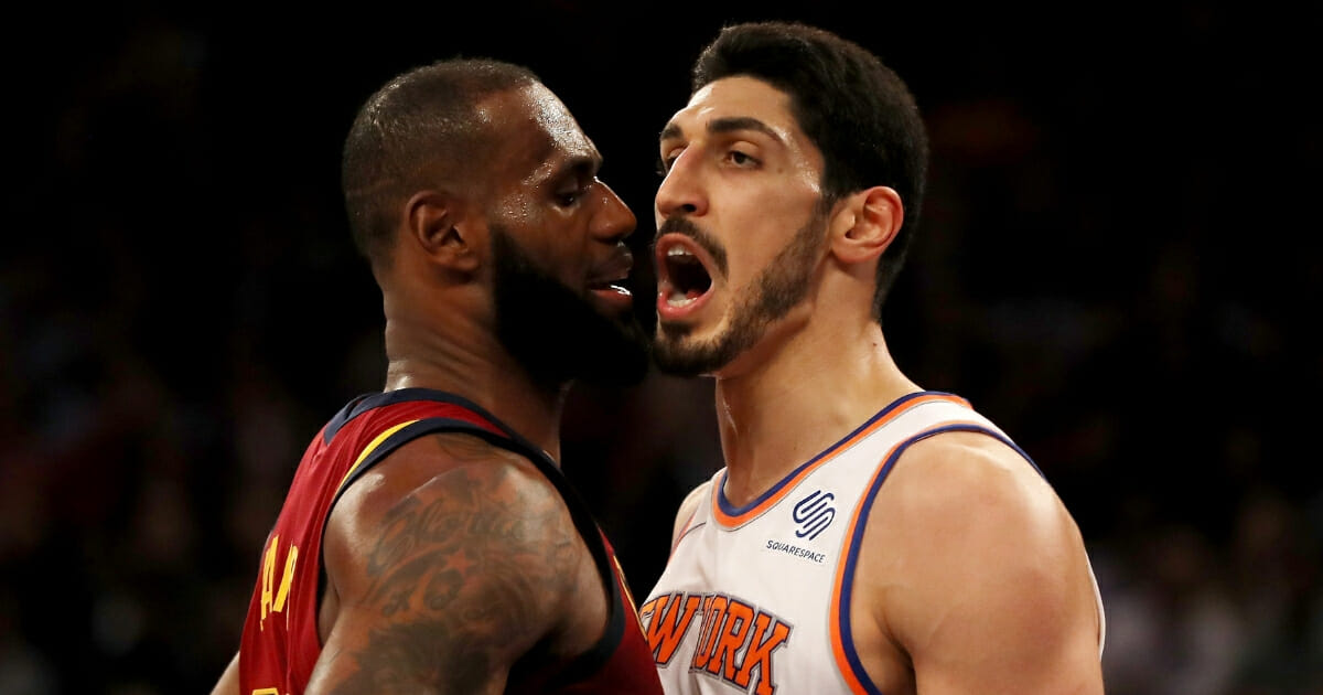 LeBron James #23, then of the Cleveland Cavaliers, and Enes Kanter #00, then of the New York Knicks, exchange words in the first half at Madison Square Garden on Nov. 13, 2017, in New York City.