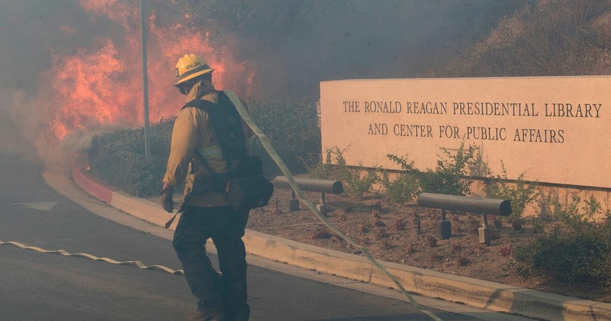 Firefighters battle to protect the Ronald Reagan Presidential Library from the Easy Fire in Simi Valley, California, on Oct. 30, 2019.