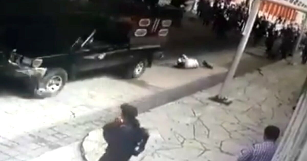 The mayor of Las Margaritas is dragged behind a truck after being beaten by an angry mob.