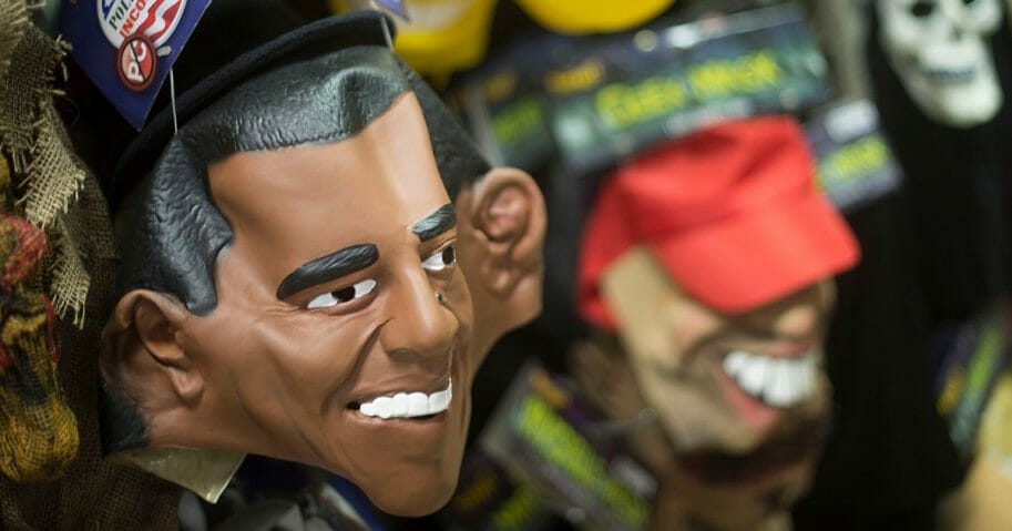 A mask of then-President Barack Obama sits with other Halloween masks on a wall at Spirit Halloween costume store in Easton, Maryland, on Oct. 21, 2013.