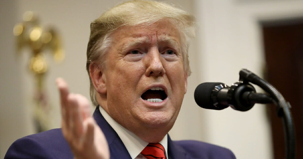 President Donald Trump responds to a reporter's question during an event at the White House in Washington.