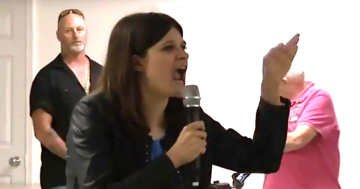 Michigan Democratic Rep. Haley Stevens screams that the "NRA has got to go!" during a town hall.